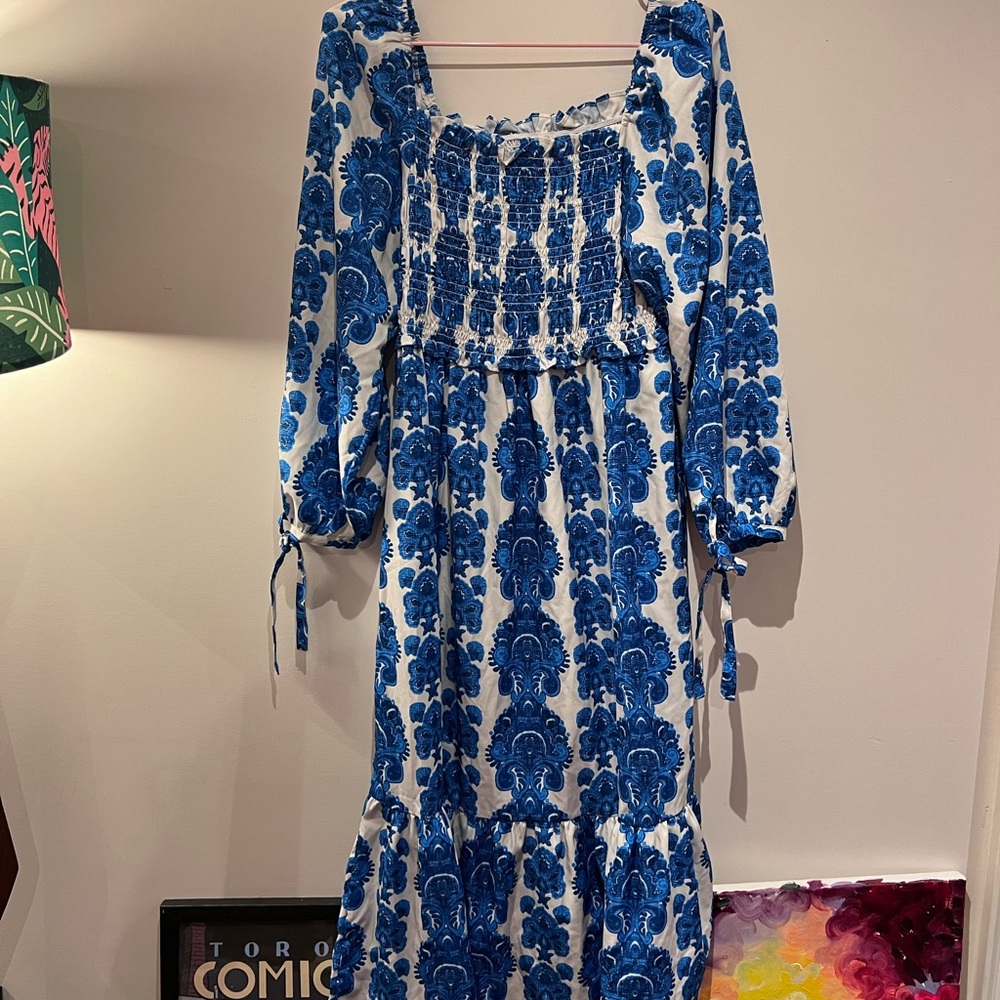 Trendy tiered dress with shirred bodice and sleeve ties L